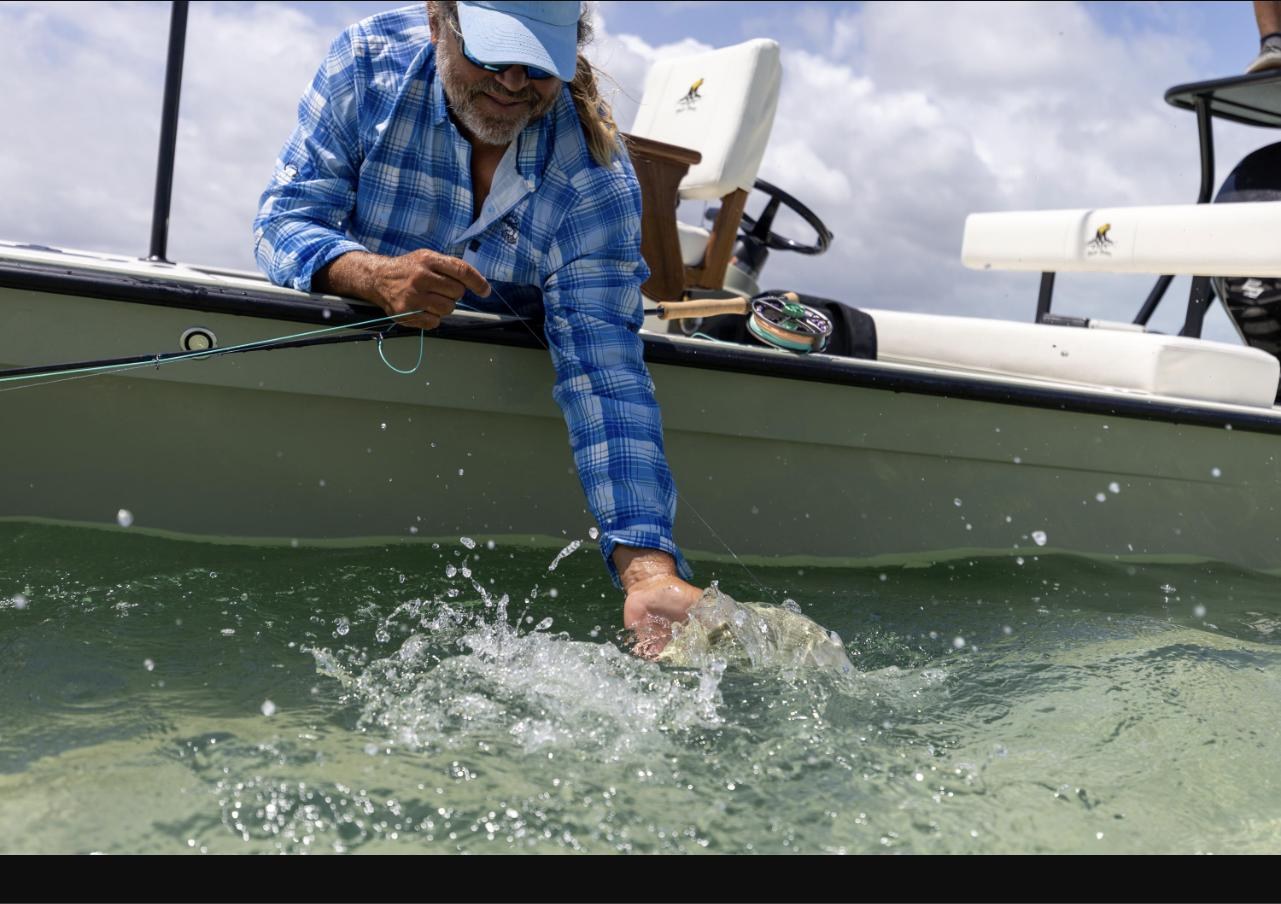 Releasing a bonefish boatside at Black Fly Lodge