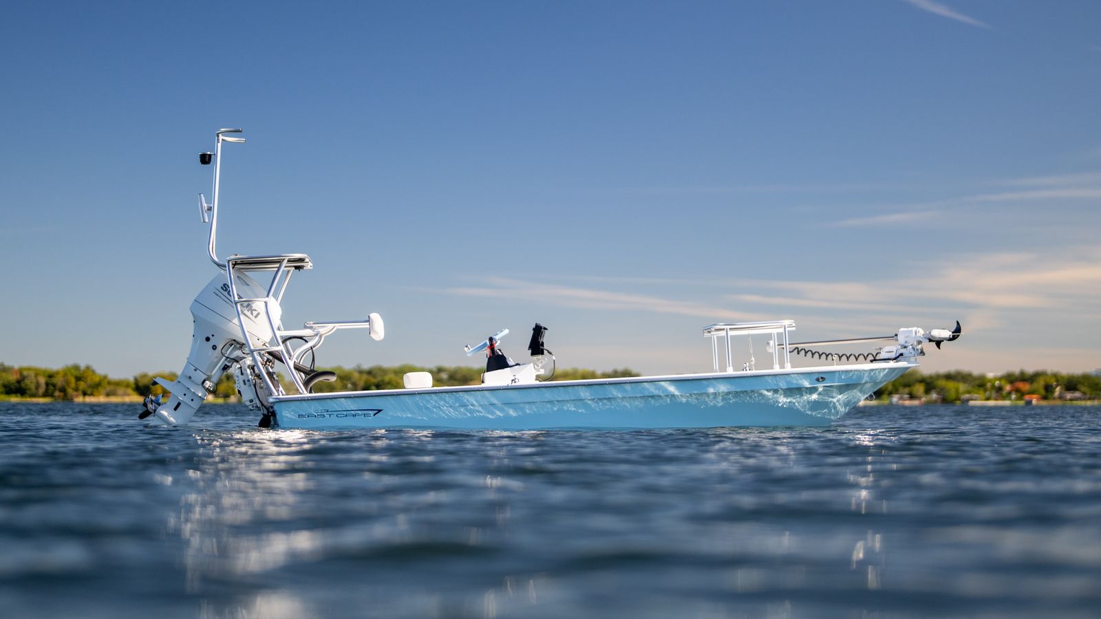 Profile at rest. Poling platform over the motor, push pole racked, Power-Pole on the transom.