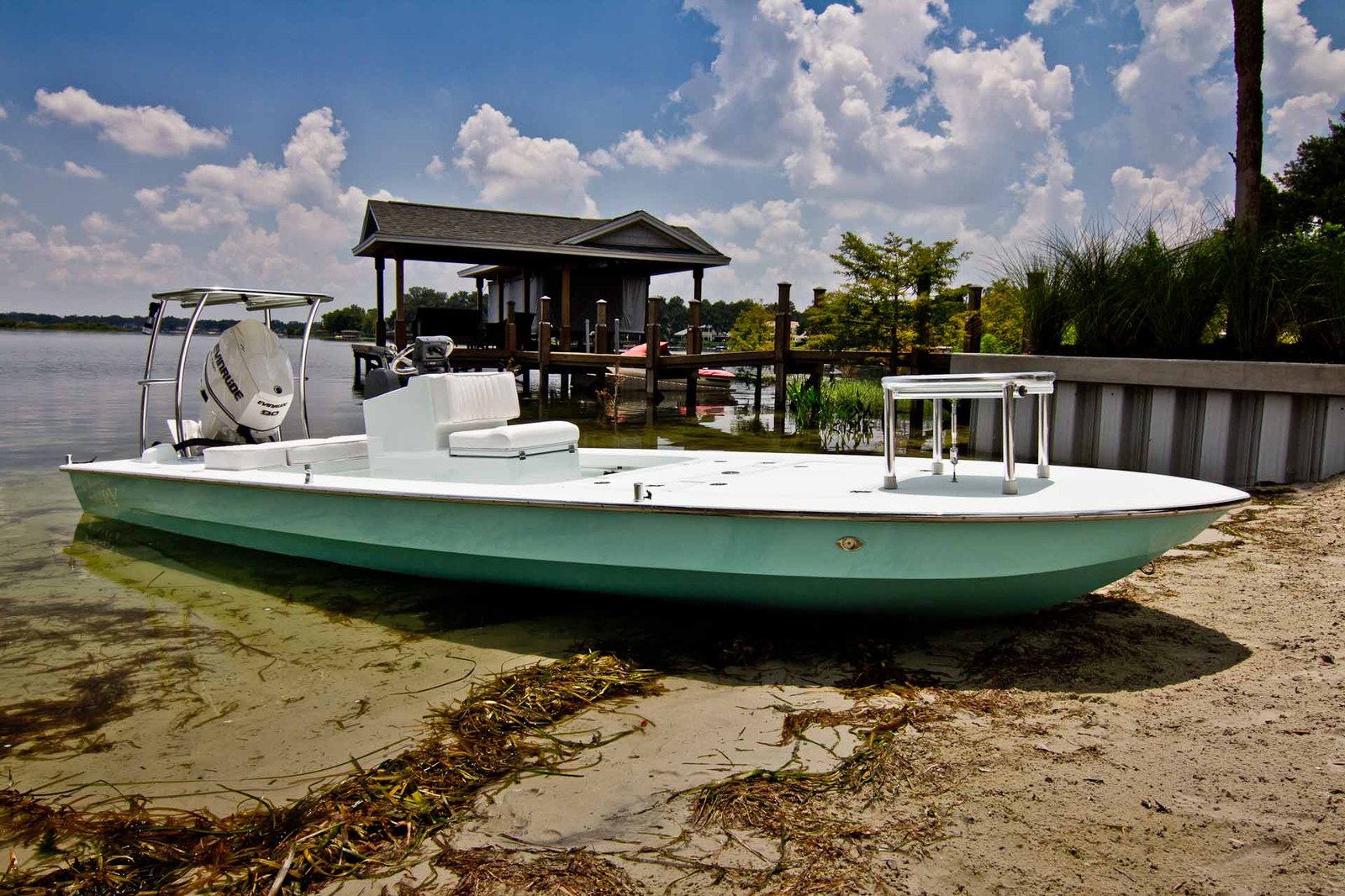 Fury in seafoam — Evinrude 90, beached on the lake sand