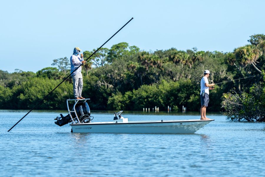 Tanner poling along the mangroves